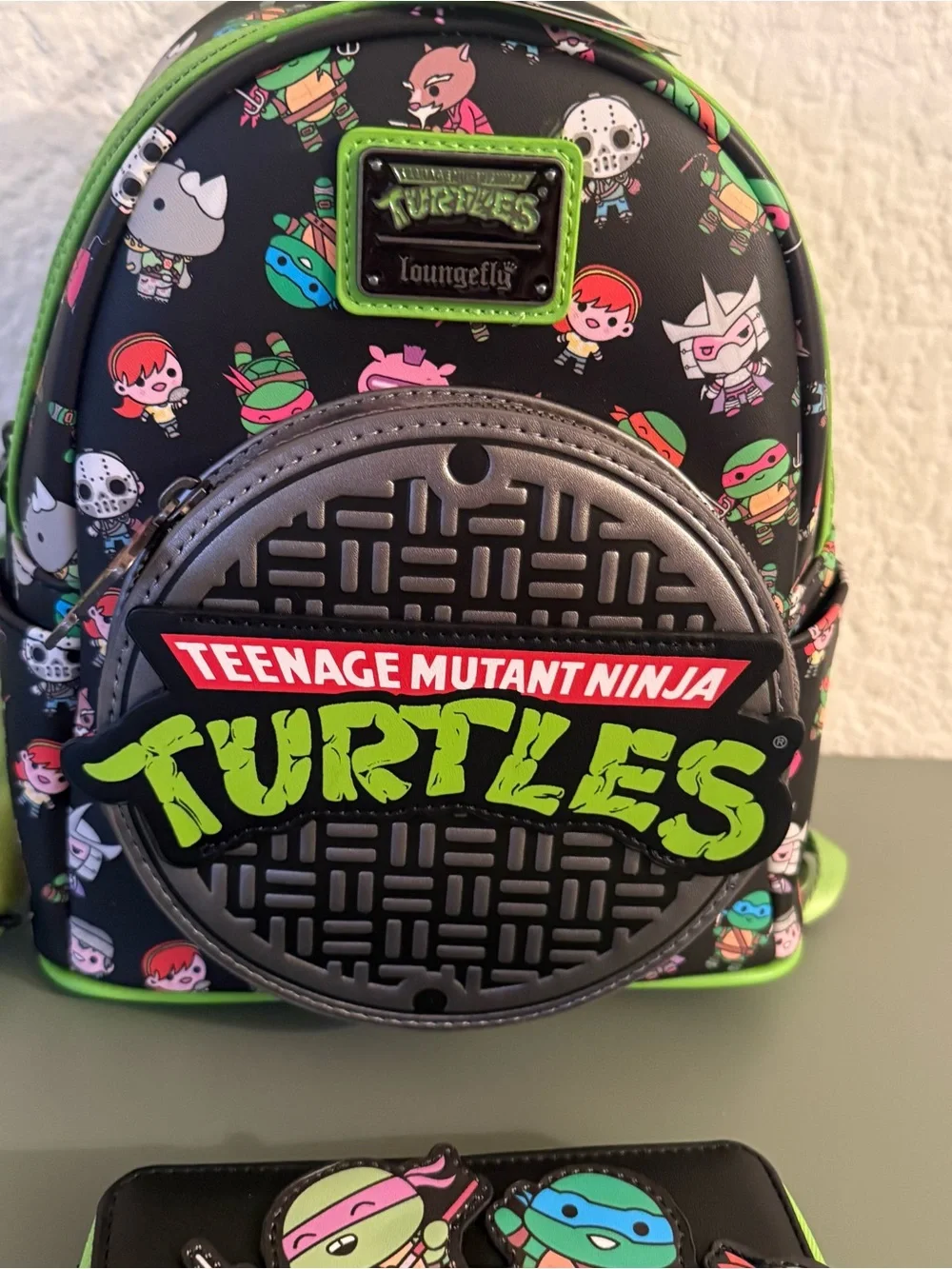 Loungefly: Teenage Mutant Ninja Turtles Sewer Cap AOP Mini Backpack and Wallet